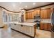 Charming kitchen features quartz countertops, stainless steel appliances, and plenty of cabinet space at 4400 English Turn Way, Wesley Chapel, FL 33543