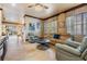 Spacious living room provides tile floors, recessed lighting, and smooth transition to other rooms at 4400 English Turn Way, Wesley Chapel, FL 33543
