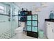 Well-organized bathroom with a glass-enclosed shower and modern storage solutions at 4419 Gaston St, Spring Hill, FL 34607