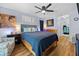 Comfortable bedroom with hardwood floors, ceiling fan, and stylish decor at 4419 Gaston St, Spring Hill, FL 34607