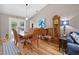 Inviting dining room featuring wood floors, modern lighting and adjoins to the pool at 4419 Gaston St, Spring Hill, FL 34607