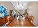 Dining area featuring a large wooden table, pendant lighting and an open layout concept at 4419 Gaston St, Spring Hill, FL 34607