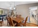 Spacious dining area showcasing hardwood floors, neutral paint and an open concept design at 4419 Gaston St, Spring Hill, FL 34607