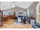 Bright and open living space with vaulted ceilings, wood floors and an adjoining dining area at 4419 Gaston St, Spring Hill, FL 34607