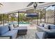 Relaxing outdoor space with a screened patio, stylish seating, and decorative pillows at 4419 Gaston St, Spring Hill, FL 34607