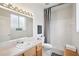 Bright bathroom features a shower, large mirror and vanity with storage at 4926 Pennecott Way, Wesley Chapel, FL 33544