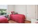 Cozy bedroom with hardwood floors, large window and bright natural light at 4926 Pennecott Way, Wesley Chapel, FL 33544