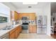 Well-lit kitchen with stainless steel appliances and ample cabinet space at 4926 Pennecott Way, Wesley Chapel, FL 33544