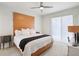 This main bedroom is bright and spacious and features a ceiling fan and sliding door at 4926 Pennecott Way, Wesley Chapel, FL 33544