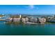 Stunning aerial view of waterfront condos with private beach and pools, nestled on the bay with bridge access at 4953 Bacopa S Ln # 205, St Petersburg, FL 33715