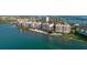 Enjoy a beautiful aerial view of waterfront condos with private beach and pools, nestled on the bay at 4953 Bacopa S Ln # 205, St Petersburg, FL 33715