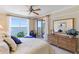 Bright bedroom with a large window and private balcony offering beautiful water views at 4953 Bacopa S Ln # 205, St Petersburg, FL 33715
