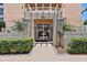 Building entrance with well-manicured landscaping and brick walkway at 4953 Bacopa S Ln # 205, St Petersburg, FL 33715