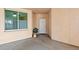 Covered entry to unit with tiled floor and plant at 4953 Bacopa S Ln # 205, St Petersburg, FL 33715