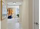 Hallway view into dining and living area with water views at 4953 Bacopa S Ln # 205, St Petersburg, FL 33715