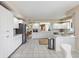 Open kitchen with white cabinetry and stainless-steel appliances at 4953 Bacopa S Ln # 205, St Petersburg, FL 33715