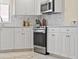 Kitchen with stainless steel oven and white marble backsplash at 4953 Bacopa S Ln # 205, St Petersburg, FL 33715