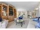 Bright living room with custom built-ins, comfortable seating, and an open floorplan at 4953 Bacopa S Ln # 205, St Petersburg, FL 33715
