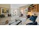 Bright living room featuring stylish decor, comfortable seating, and access to a private balcony at 4953 Bacopa S Ln # 205, St Petersburg, FL 33715