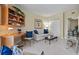 Cozy living room features a built-in desk, comfortable seating, and ample lighting at 4953 Bacopa S Ln # 205, St Petersburg, FL 33715