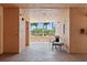 Inviting lobby with seating and a view of lush palm trees and landscaping at 4953 Bacopa S Ln # 205, St Petersburg, FL 33715