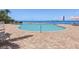 Enjoy this beautiful in-ground pool with comfortable lounge chairs with a clear ocean view at 4953 Bacopa S Ln # 205, St Petersburg, FL 33715