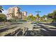 Well-maintained tennis court surrounded by lush landscaping, perfect for active recreation at 4953 Bacopa S Ln # 205, St Petersburg, FL 33715