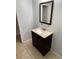 Bathroom featuring a single vanity and tile floors, with neutral paint at 5042 Terrace Village Ln, Tampa, FL 33617