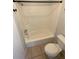 Clean bathroom featuring a shower and a standard white toilet at 5042 Terrace Village Ln, Tampa, FL 33617