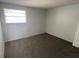 This bedroom has neutral walls and a window providing natural light at 5042 Terrace Village Ln, Tampa, FL 33617