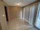 Dining room space featuring sliding glass doors, neutral paint, and tile flooring at 5042 Terrace Village Ln, Tampa, FL 33617