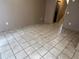 Living room featuring neutral paint and tiled floors, and a staircase leading to the bedrooms at 5042 Terrace Village Ln, Tampa, FL 33617