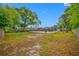 Expansive backyard with a screened-in pool area at 538 Bamboo Ln, Clearwater, FL 33764