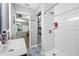 Bathroom featuring white subway tile shower, blue and white decorative floor tile at 538 Bamboo Ln, Clearwater, FL 33764