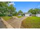 Lovely home with a spacious lawn and driveway, providing ample parking and outdoor space at 538 Bamboo Ln, Clearwater, FL 33764