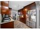 Well-equipped kitchen with stainless steel appliances, stylish cabinets, and a view of the living space at 538 Bamboo Ln, Clearwater, FL 33764