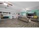 Spacious living room with wood flooring, comfortable seating, and natural light at 538 Bamboo Ln, Clearwater, FL 33764