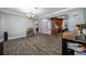 Bright living room with wood-look floors and a seamless transition into the modern kitchen at 538 Bamboo Ln, Clearwater, FL 33764