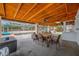 Covered outdoor patio with dining area and view of the pool at 538 Bamboo Ln, Clearwater, FL 33764