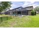 The backyard has a nice fenced in area, pool and outdoor furniture at 5931 Cherry Oak Dr, Valrico, FL 33596