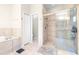Bathroom features dual sinks, a soaking tub, and a glass-enclosed shower at 5931 Cherry Oak Dr, Valrico, FL 33596