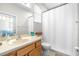 A clean bathroom featuring a single vanity and shower/tub combo with natural light, ideal for a fresh start at 5931 Cherry Oak Dr, Valrico, FL 33596