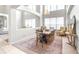 Open dining area with soaring ceilings, stylish lighting, and comfortable seating for entertaining at 5931 Cherry Oak Dr, Valrico, FL 33596