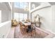 Elegant dining room with soaring ceilings, chandelier, and large windows providing ample natural light at 5931 Cherry Oak Dr, Valrico, FL 33596