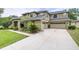 Stunning two-story home with attached three-car garage and well-maintained landscaping at 5931 Cherry Oak Dr, Valrico, FL 33596