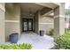 Inviting front porch featuring double doors, stucco columns, and decorative planters for a welcoming entrance at 5931 Cherry Oak Dr, Valrico, FL 33596