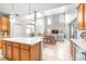 Bright, open kitchen flowing into the living area, featuring an island with modern lighting and cabinetry at 5931 Cherry Oak Dr, Valrico, FL 33596