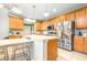 Spacious kitchen with a large island and breakfast bar, stainless steel appliances, and abundant storage at 5931 Cherry Oak Dr, Valrico, FL 33596