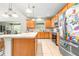 Bright kitchen featuring a large island, stainless steel appliances, and lots of cabinet space at 5931 Cherry Oak Dr, Valrico, FL 33596