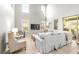 Bright living room with tall windows, a comfortable couch, and access to the lanai at 5931 Cherry Oak Dr, Valrico, FL 33596